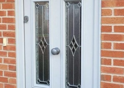 Bowmont Composite door with Riviera glass and bee knocker