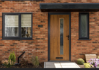 Bleaklow composite front door in oak with anthracite grey outerframe, fitted in Poole, Dorset