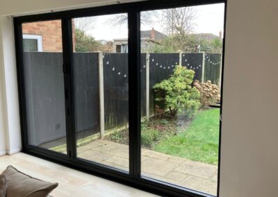 Smart black bi-folds installed Bournemouth