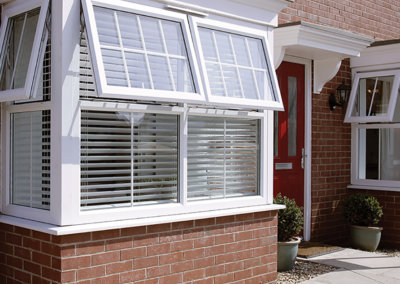 Georgian Bar White UPVC windows, top hung hinges