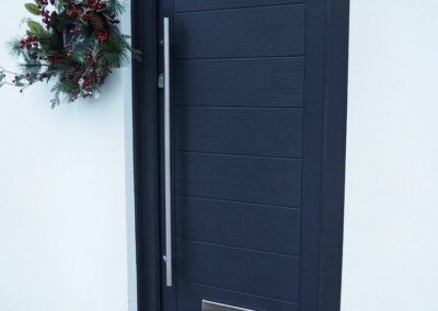 Mayon Blue composite door with long bar handle